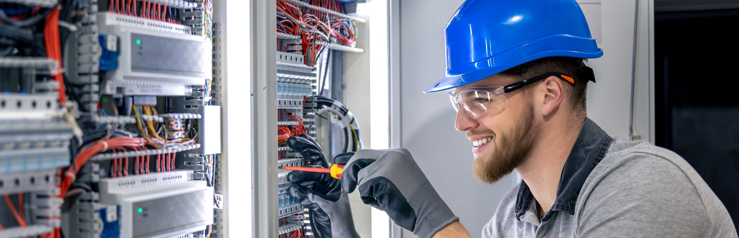 Electrician working on the control cabinet